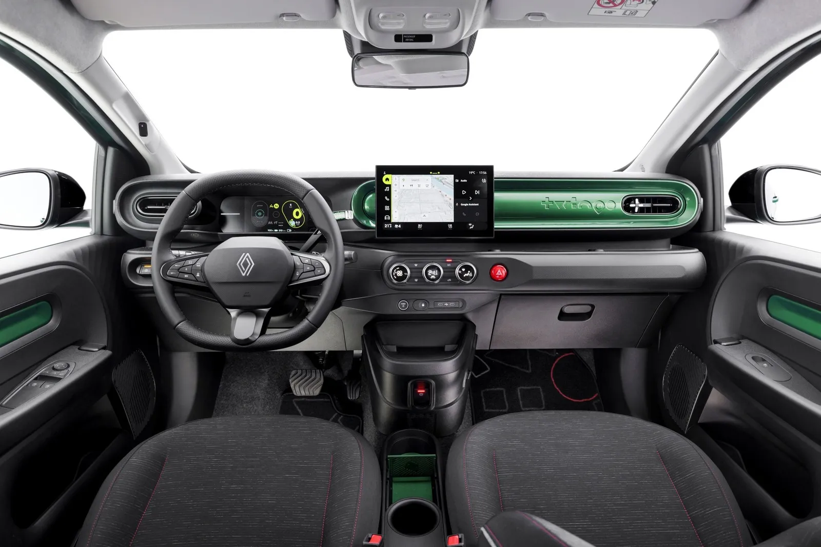 Innenraum des Renault Twingo Electric mit digitalem Cockpit, Touchscreen und grünem Armaturenbrett.